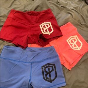 3 Born Primitive Women's Athletic Shorts - Red, Pink, and Blue
